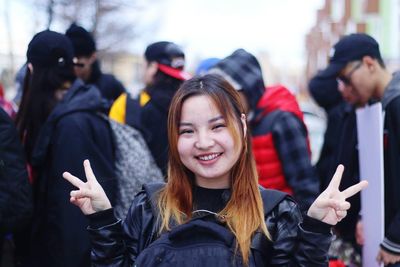 Portrait of smiling woman in city