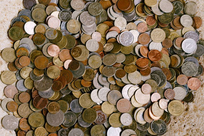 High angle view of coins on floor