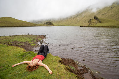 Woman enjoying nature, corvo island, azores, by the lake, wanderlust.