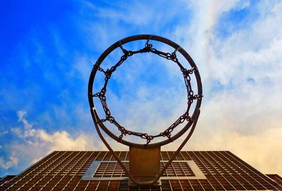 Low angle view of basketball hoop against sky