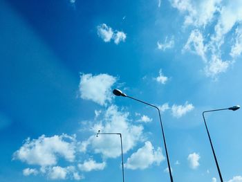 Low angle view of street light against sky