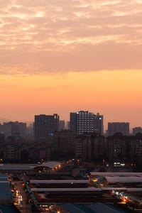 High angle view of city at sunset