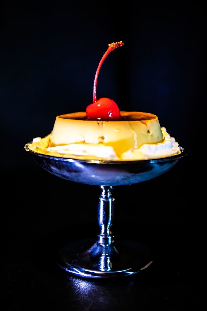 CLOSE-UP OF DRINK ON TABLE