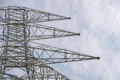 Low angle view of communications tower against sky