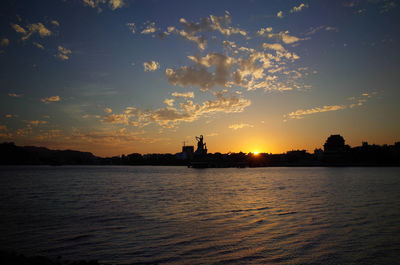 Scenic view of sunset over river