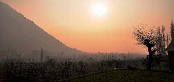 Scenic view of landscape against sky during sunset