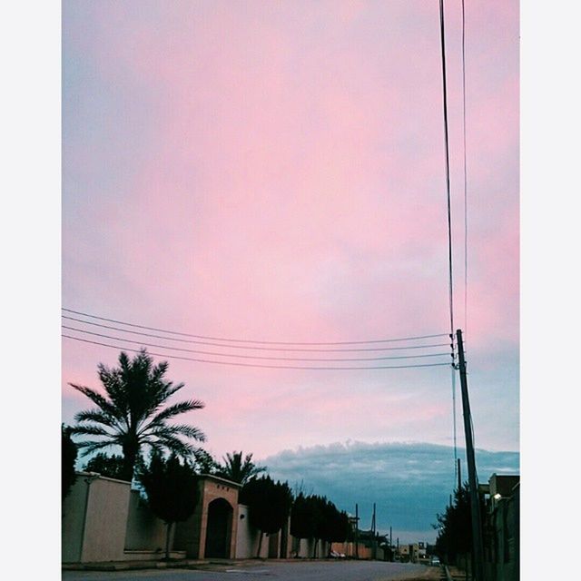 sky, palm tree, built structure, architecture, building exterior, tree, low angle view, sunset, cloud - sky, house, auto post production filter, cloud, transfer print, nature, no people, outdoors, sea, street light, horizon over water, power line