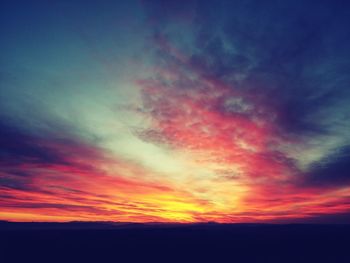 Scenic view of landscape against cloudy sky