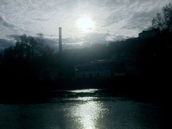 Scenic view of silhouette trees against sky