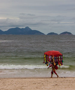 Female vendor selling bras at beach