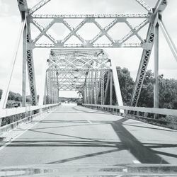 Low angle view of suspension bridge against sky