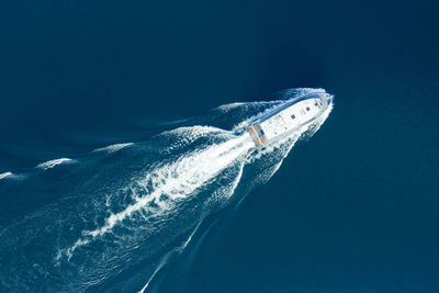 Aerial view of sea against clear blue sky