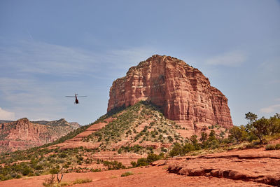 Low angle view of rock formation against sky