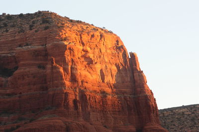 Low angle view of rock formation against clear sky