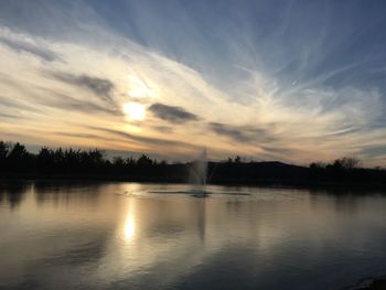 Scenic view of lake against sky during sunset