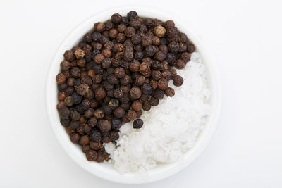 High angle view of eggs in bowl against white background