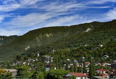 High angle view of buildings and mountains against sky