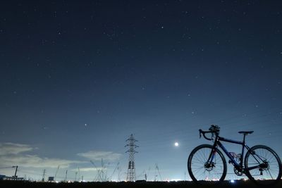 Low angle view of silhouette against clear sky at night