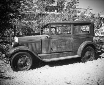 Abandoned vehicle on tree