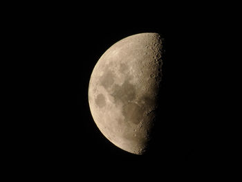 Low angle view of moon against clear sky at night