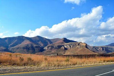 Scenic view of landscape against cloudy sky