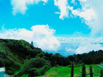 Panoramic view of green landscape against sky