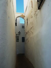 White building seen through archway