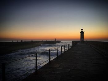 Scenic view of sea against clear sky during sunset