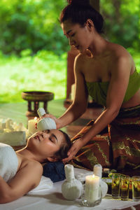 Woman giving massage to client