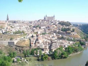 View of cityscape against blue sky