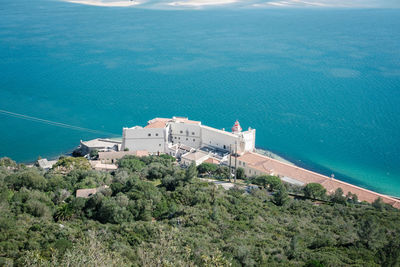 High angle view of townscape by sea