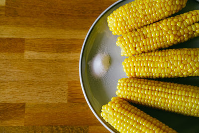 High angle view of boiled corn in bowl on table