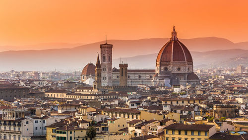 High angle view of city against sky during sunset