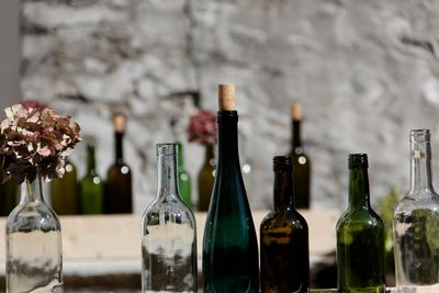 Close-up of wine bottles on table