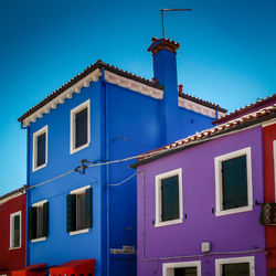 Low angle view of building against blue sky