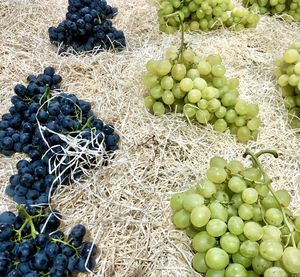 High angle view of grapes for sale at market stall