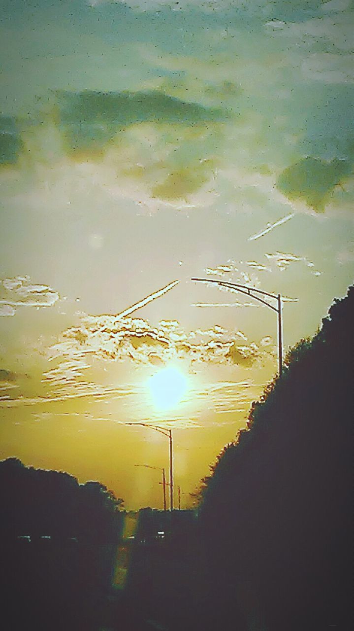 sunset, electricity pylon, power line, silhouette, electricity, power supply, sky, street light, connection, fuel and power generation, cable, orange color, power cable, nature, road, outdoors, street, no people, sun, sunlight