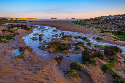 Rocky beach at sunset