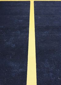 Yellow arrow symbol on road