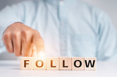 Midsection of man holding toy