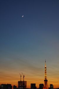 View of communications tower in city