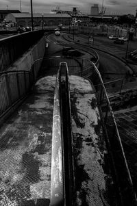 High angle view of railroad tracks by road in city