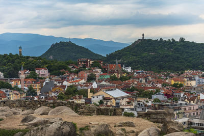 Buildings in town against sky