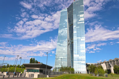 Low angle view of buildings against cloudy sky