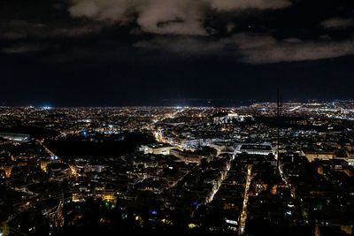 Aerial view of illuminated city at night