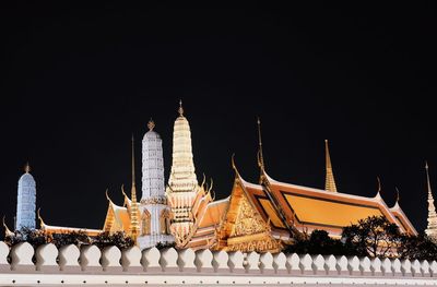 Low angle view of temple building against sky at night