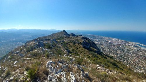 Scenic view of mountains against clear blue sky