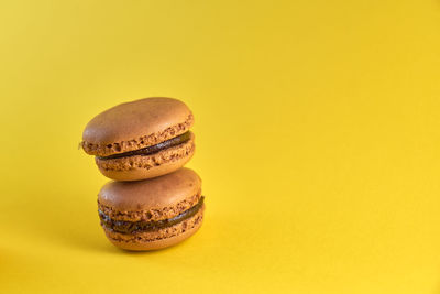 Close-up of cookies against yellow background