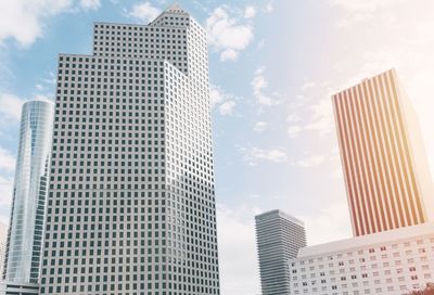 Low angle view of modern buildings against sky in city