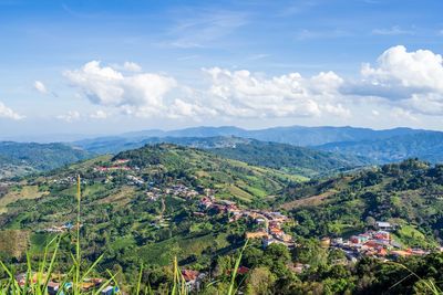 Scenic view of landscape and mountains against sky